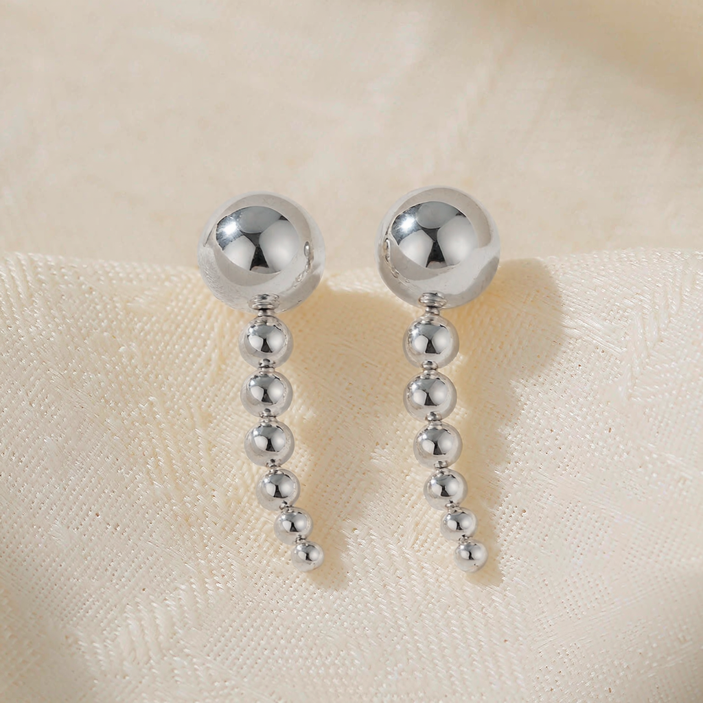 Comet Drop Earrings — Silver — macro view