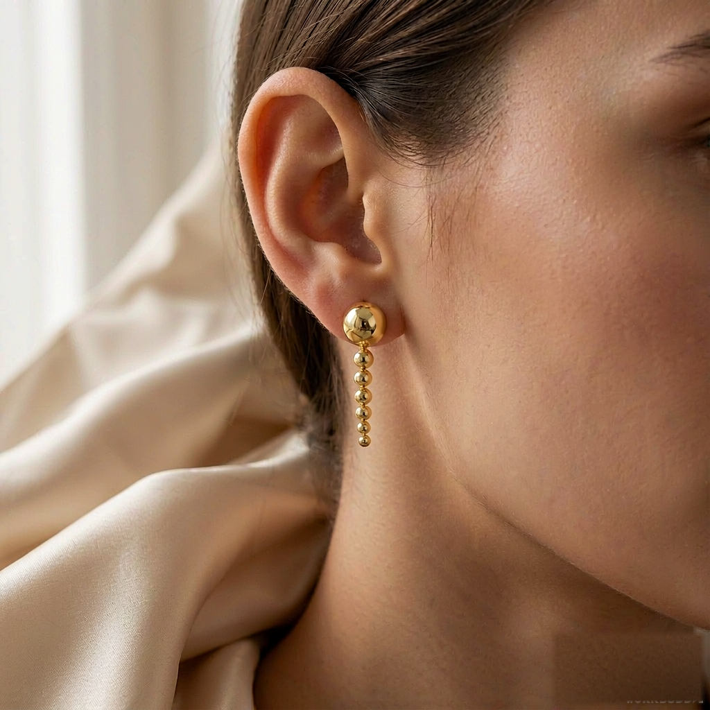VARYNOXA Comet Drop Earrings — worn view