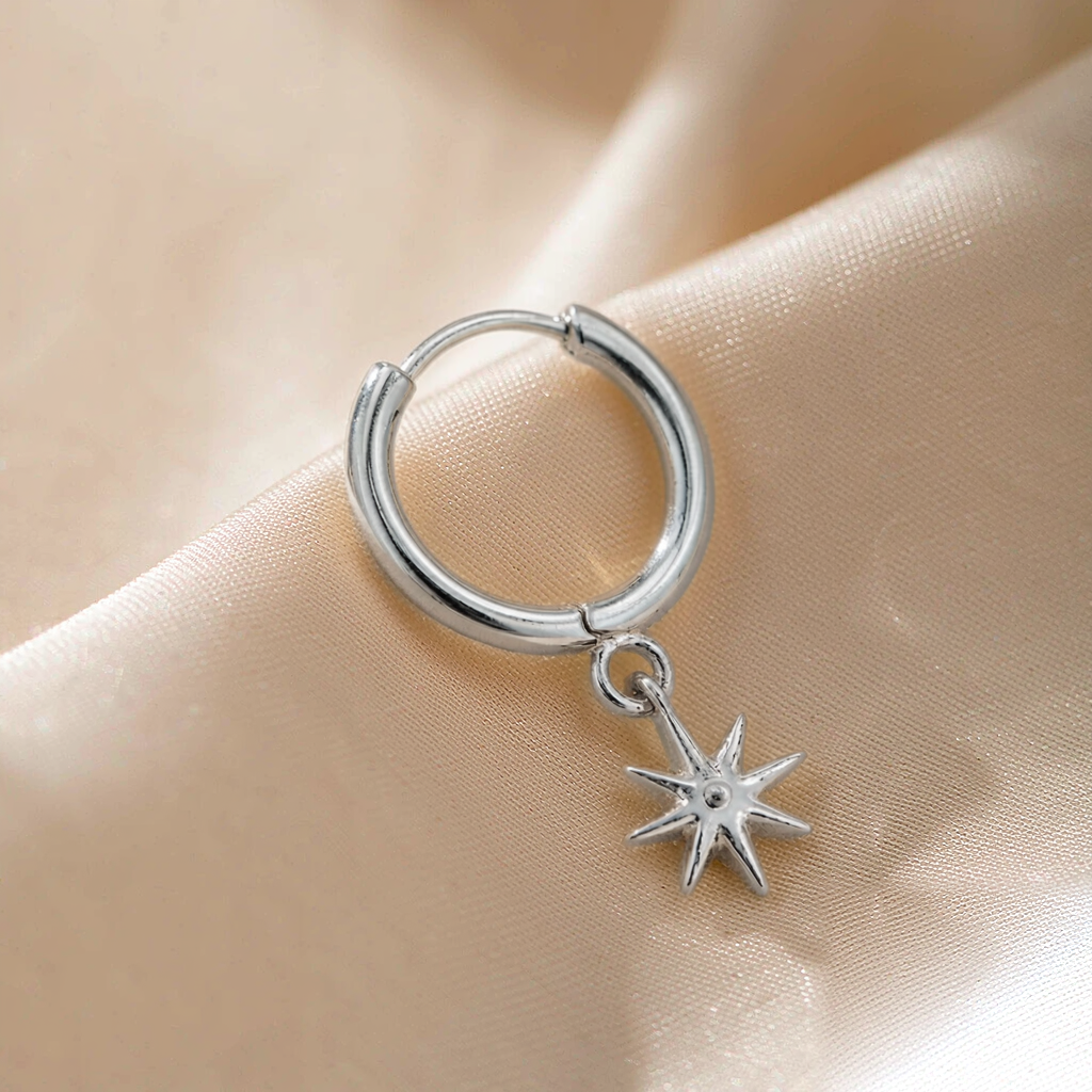 Cosmic Huggie Hoop Earrings — Silver — macro view