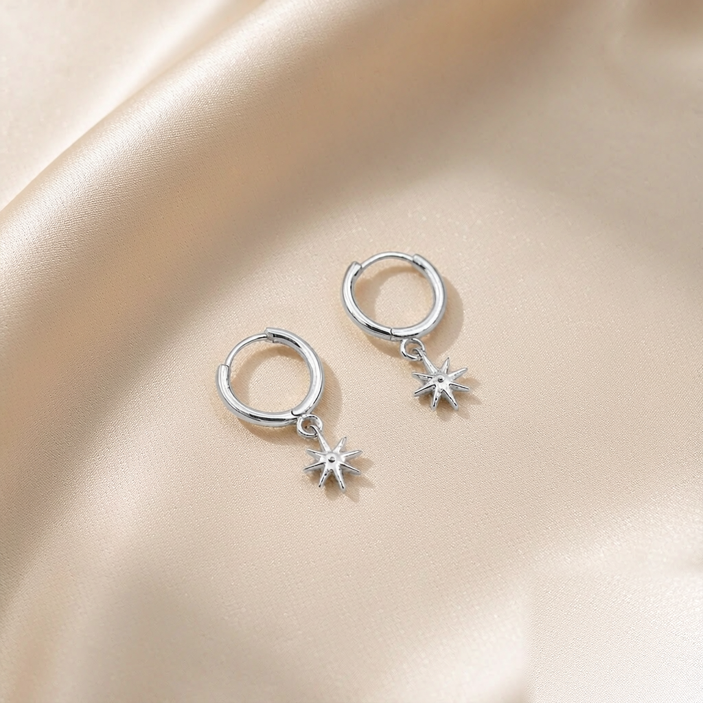Cosmic Huggie Hoop Earrings — Silver — studio view