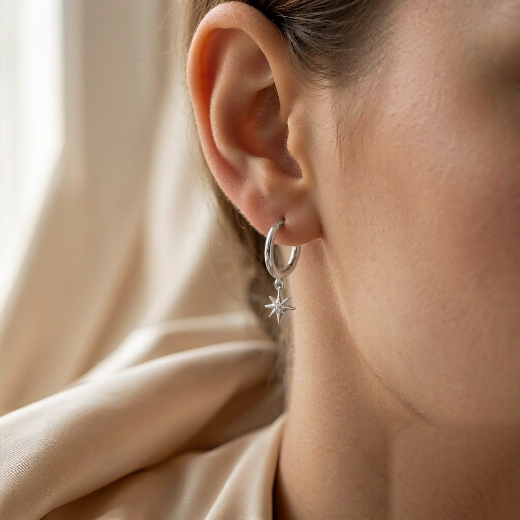 Cosmic Huggie Hoop Earrings — Silver — worn view
