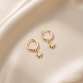 VARYNOXA Cosmic Huggie Hoop Earrings — studio view